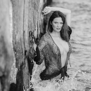 Brunette topless model and the sea