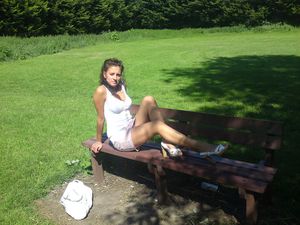 Brunette posing at the park bench