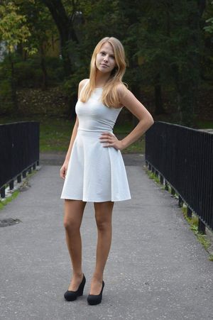Blonde chick in white dress and black wedges