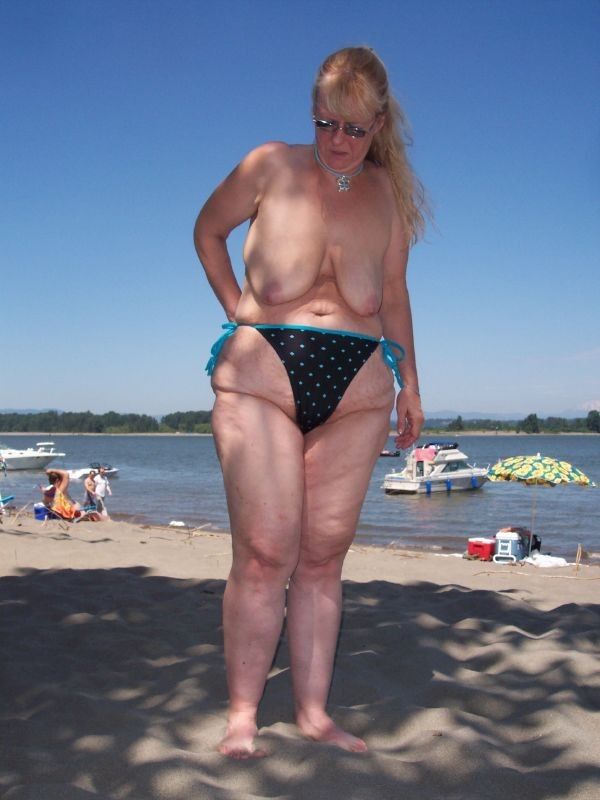 Panties almost cover her saggy tits