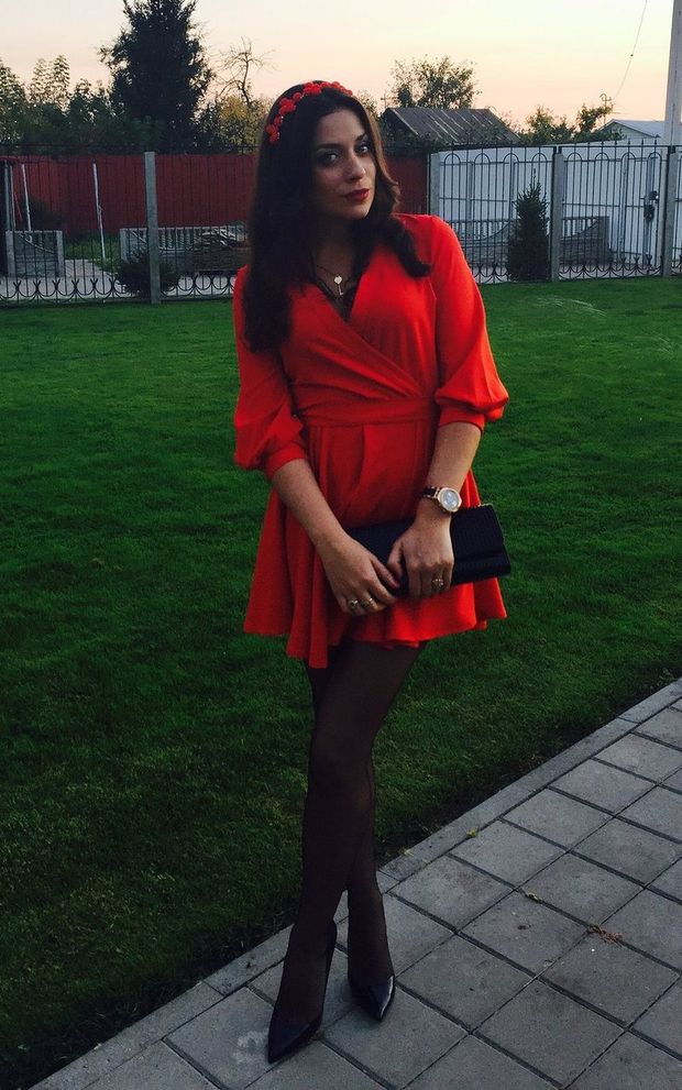 Sexy dark hair girl in mini red dress, pantyhoses and stilettos