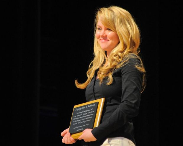 Kara Robinson accepts plaque at graduation of South Carolina Criminal Justice Academy in 2010. She showed her mettle eight years earlier as a 15-year-old, getting away from killer Richard Marc Evonitz.