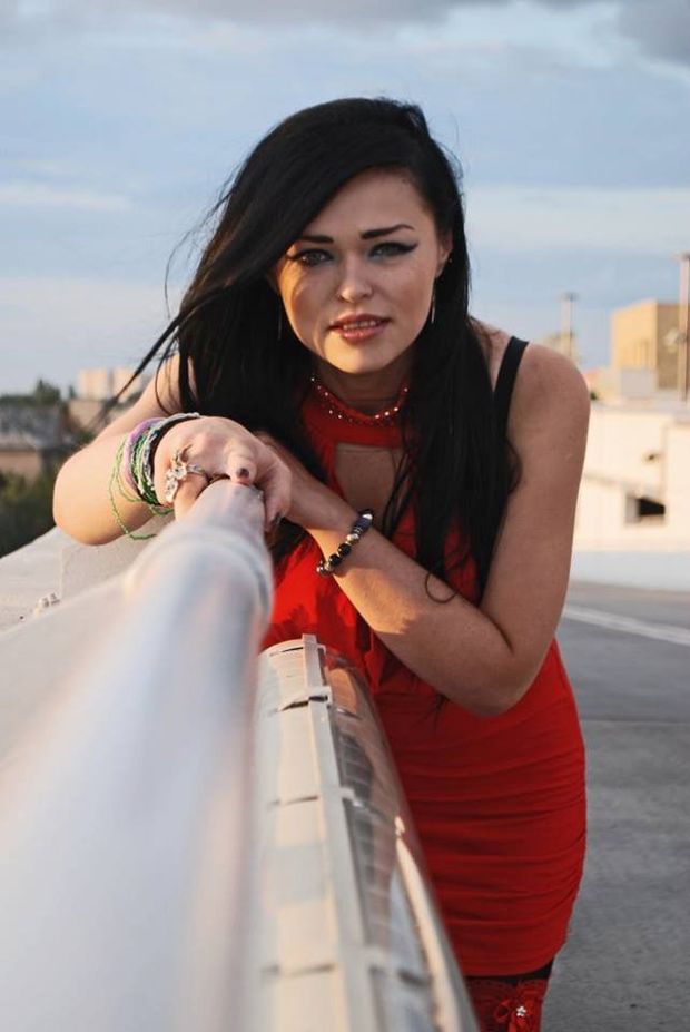 Pretty brunette posing on the bridge