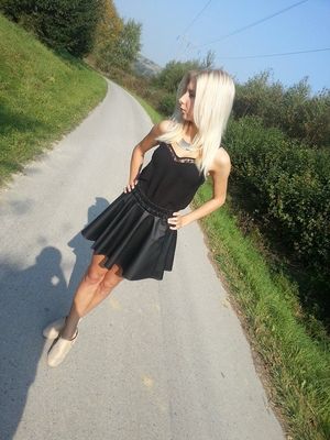 Blonde countrygirl in leather skirt
