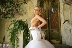 Nika stripping out of wedding dress