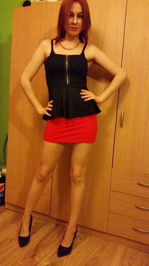 Redhead rookie in sexy outfit posing at home