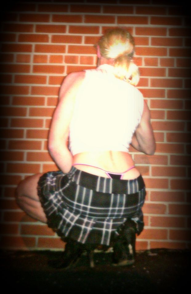 Young teen squatting in a skirt!