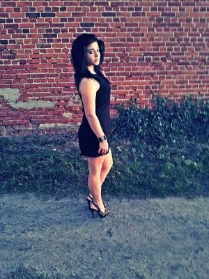 Brunette posing outdoors