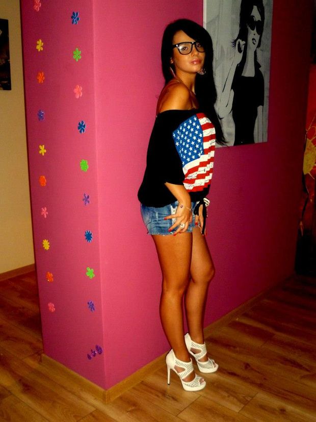 Tanned leggy dark hair bimbo posing at home