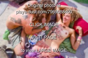 bodypainting at center camp - burning man 2012, back tattoos, blonde, body art, bodypaint, dreads, justin stone, lying, lying down, paint, painting, people, topless, topless woman, tree painting