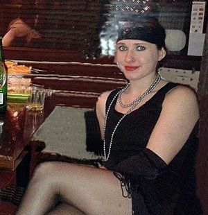 Dark hair rookie in vintage outfit at the party