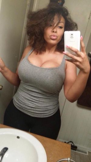Big titted ebony babe taking selfie