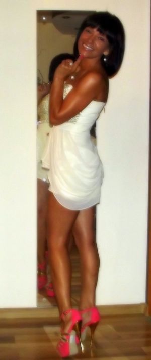 Tanned mature posing at home