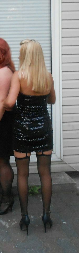 Blonde bimbo in her slutty outfit waiting oustide