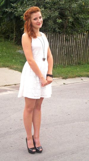 Cute pretty redhead chick in white dress