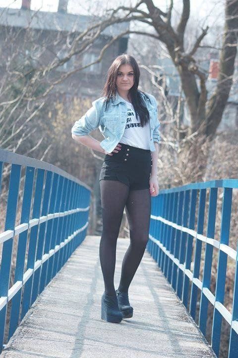 Leggy brunette posing on the bridge