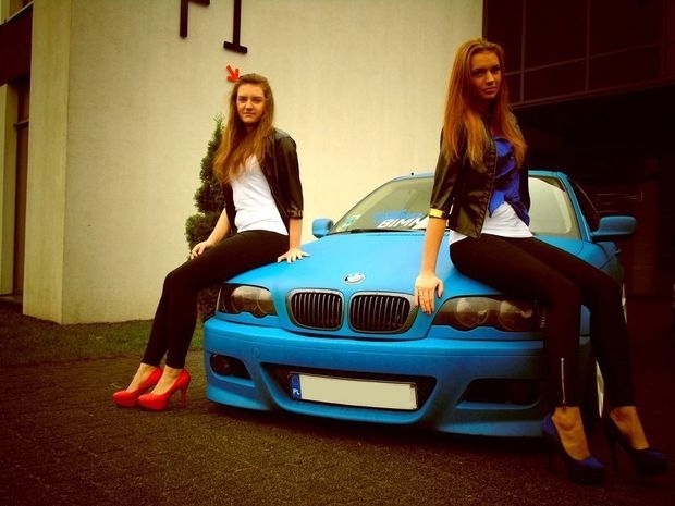 Two leggy bimbos and a bimbo-magnet type car