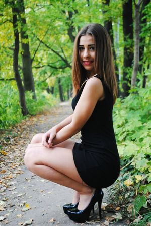 Tight black mini dress on very attractive brunette