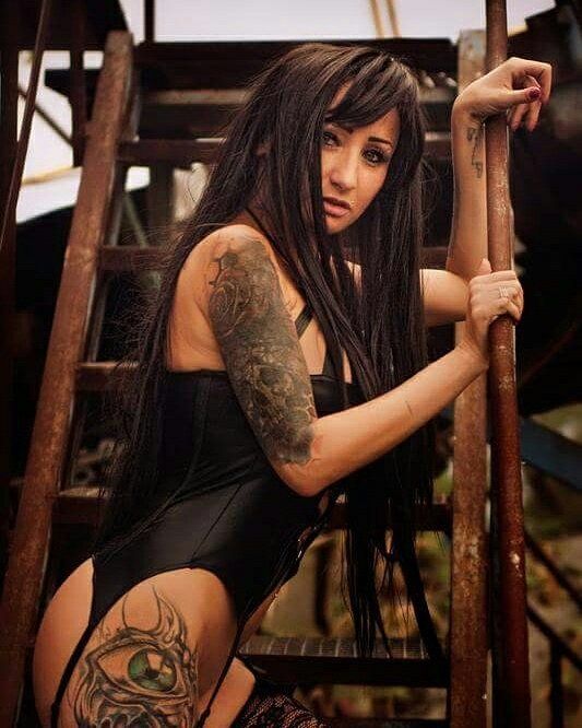 tatooed brunette in sexy corset