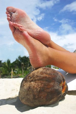 Foot on foot on fruit