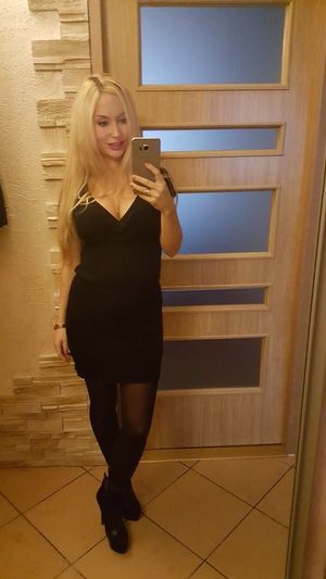 Nice busty blonde in mini black dress
