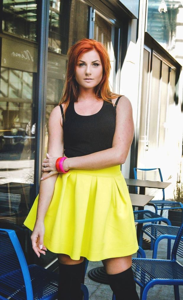 Nice redhead chick outdoors in yellow skirt and knee highs