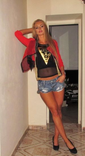 Attention whore posing in her skimpy outfit before night out