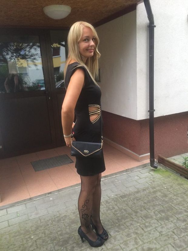 Tempting blonde in sexy black dress