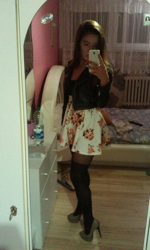 Brunette rookie in cute mini skirt and leather jacket