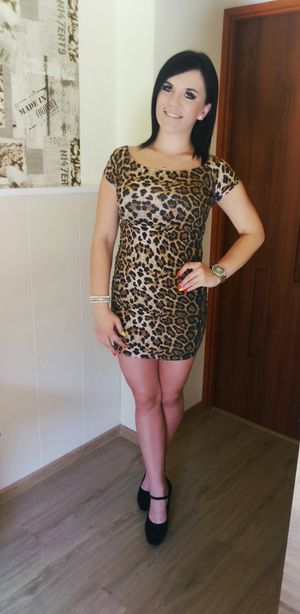 Brunette bimbo in tight mini dress