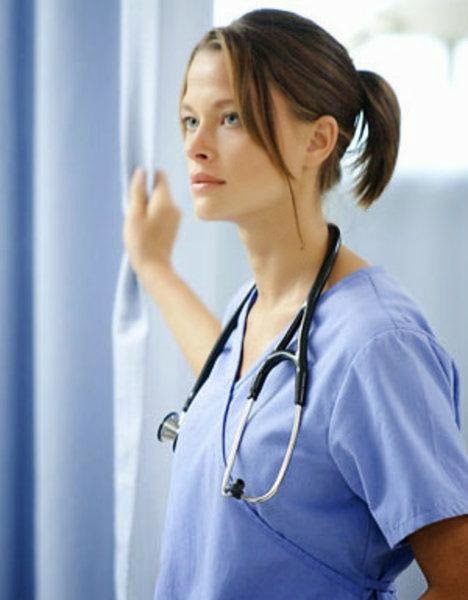 Scottie Thompson - wearing scrubs