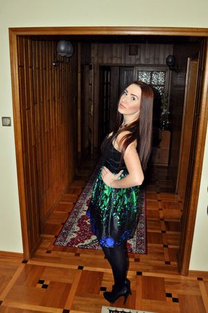 Nice brunette with long hair in nice outfit