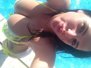 Downward selfie, gorgeous chick in the pool, huge tits