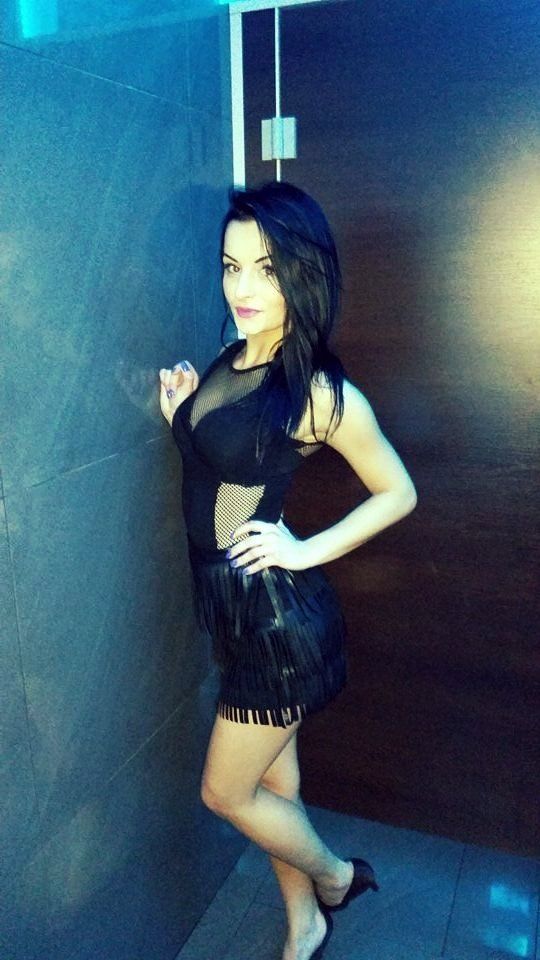 Sexy brunette in see thru dress at the party