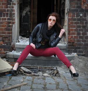 Sexy redhead chick posing outdoors