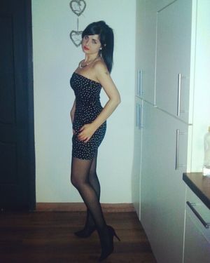 Nice dark hair hottie in tight mini dress and black stilettos