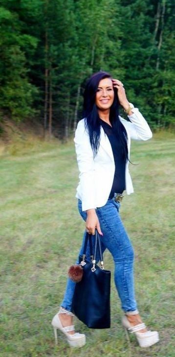 Nice brunette in extreme high heels outdoors