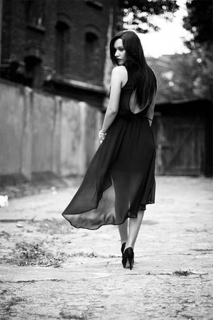 Dark hair model in loose long transparent dress