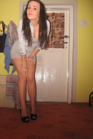 Cute brunette in simple but sexy tight mini dress