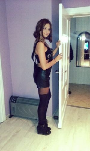 Redhead in kinky leather outfit