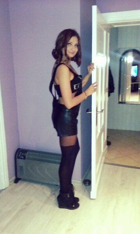 Redhead in kinky leather outfit