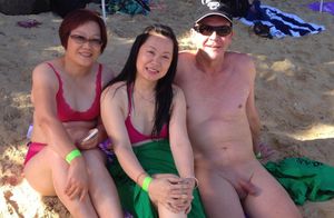 Clothed Asian female naked male