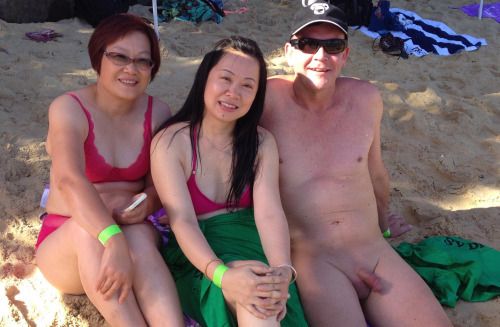 Clothed Asian female naked male