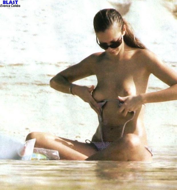 Kartika Luyet caught topless on a beach paparazzi photo