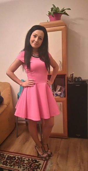Nice brunette in mini pink loose dress