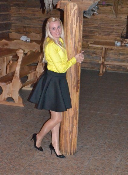 Blonde chick in shiny nylons and black stilettos