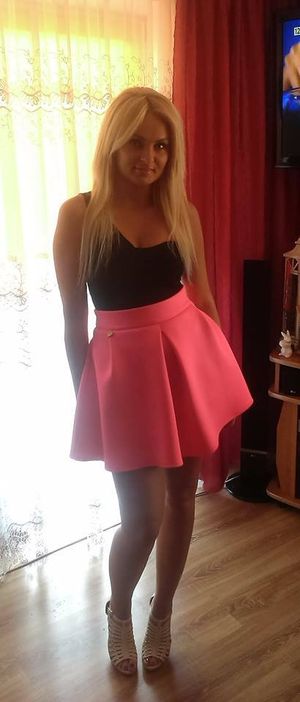 Sexy blonde in cute outfit at home