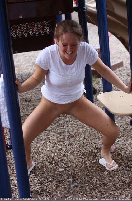 Teen peeing on the playground