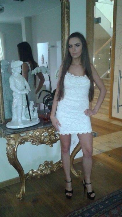 Leggy bimbo in tight white mini dress and high black hookerheels