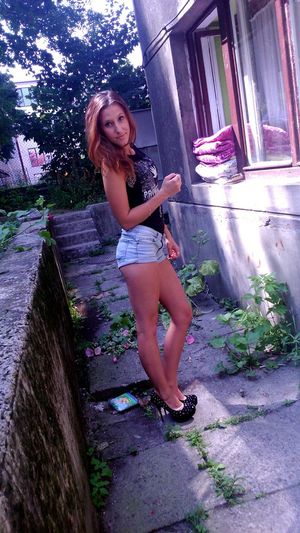 Nice leggy chick outdoors in really "cool" outfit